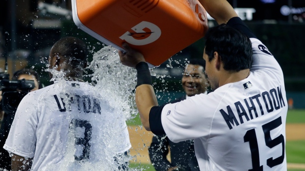 Justin Upton and Tigers Celebrate, The Canadian Press Justin Upton and Tigers Celebrate