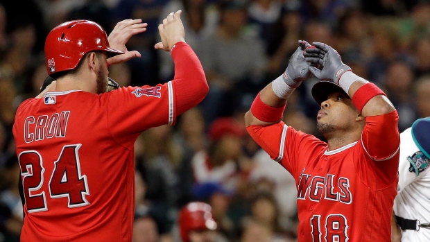 Luis Valbuena and C.J. Cron, The Canadian Press Luis Valbuena and C.J. Cron
