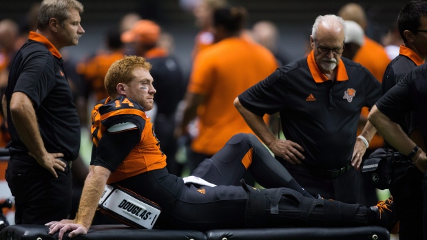 Travis Lulay sits on stretcher