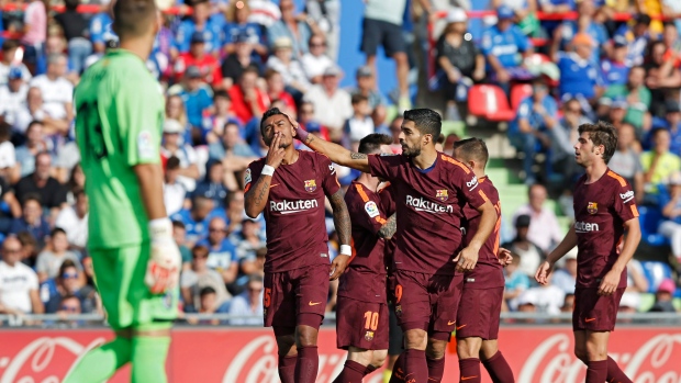 Paulinho, Barcelona celebrate, The Canadian Press Paulinho, Barcelona celebrate