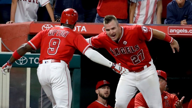 Justin Upton, Mike Trout , The Canadian Press Justin Upton, Mike Trout