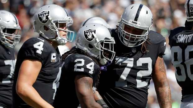 Derek Carr Marshawn Lynch , The Canadian Press Derek Carr Marshawn Lynch