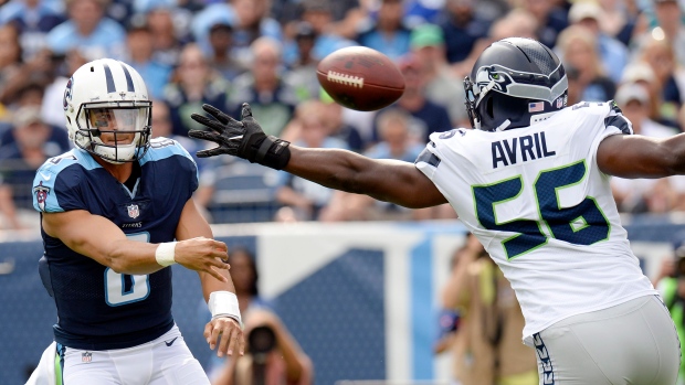 Marcus Mariota and Cliff Avril , The Canadian Press Marcus Mariota and Cliff Avril