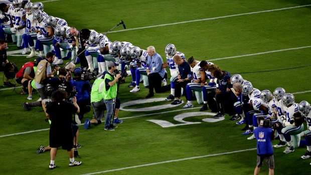 Jerry Jones and Dallas Cowboys kneel before anthem, The Canadian Press Jerry Jones and Dallas Cowboys kneel before anthem