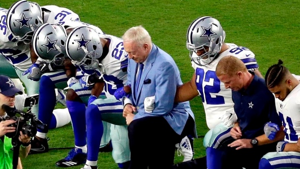 Jerry Jones and Dallas Cowboys kneel during anthem