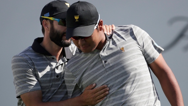 Adam Hadwin and Hideki Matsuyama, The Canadian Press Adam Hadwin and Hideki Matsuyama