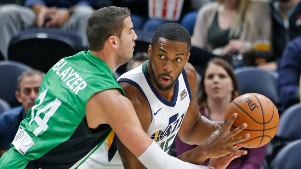 Oz Blayzer and Derrick Favors, The Canadian Press Oz Blayzer and Derrick Favors