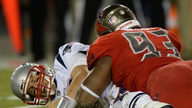 Tom Brady and Gerald McCoy, The Canadian Press Tom Brady and Gerald McCoy