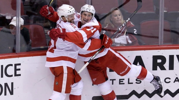 Luke Glendening and Dylan Larkin celebrate goal