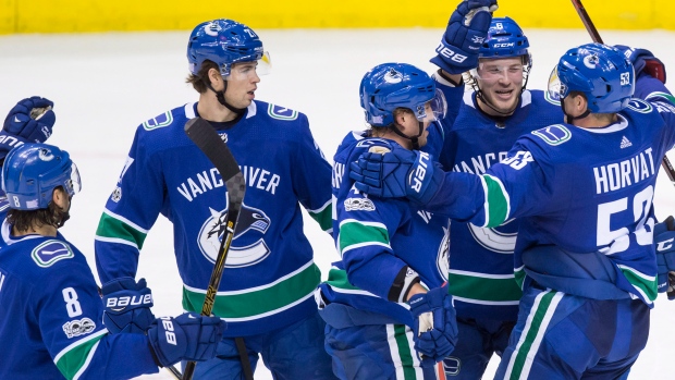 Vancouver Canucks celebrate, The Canadian Press Vancouver Canucks celebrate