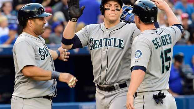 Mariners keep slim playoff hopes alive with 7-5 victory over Blue Jays