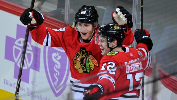 Alex DeBrincat, Patrick Kane, The Canadian Press Alex DeBrincat, Patrick Kane
