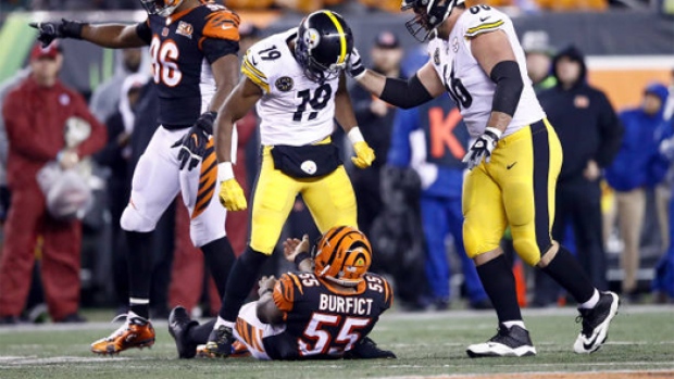 Juju Smith-Schuster stands over Vontaze Burfict