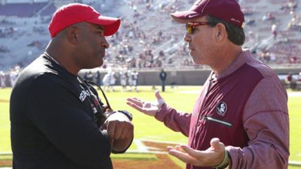 Jimbo Fisher, right, and Kenny Carter
