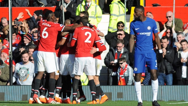 Manchester United players celebrate, The Canadian Press Manchester United players celebrate