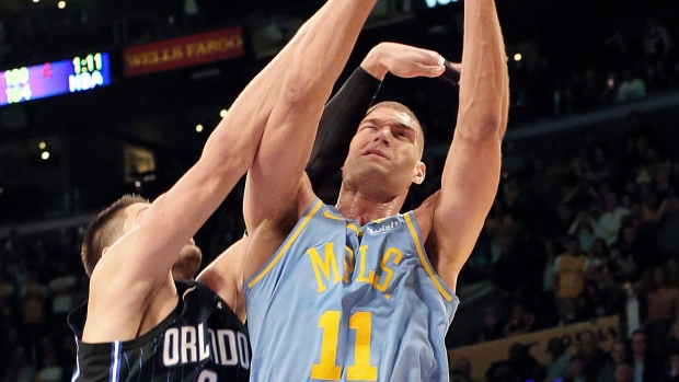 Nikola Vucevic and Brook Lopez , The Canadian Press Nikola Vucevic and Brook Lopez