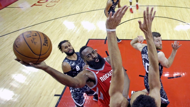 James Harden, center, The Canadian Press James Harden, center