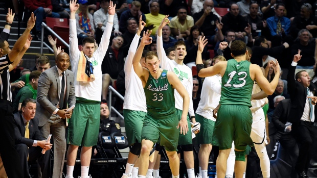 Marshall players celebrate, The Canadian Press Marshall players celebrate