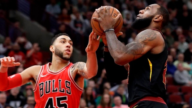 LeBron James drives on Denzel Valentine