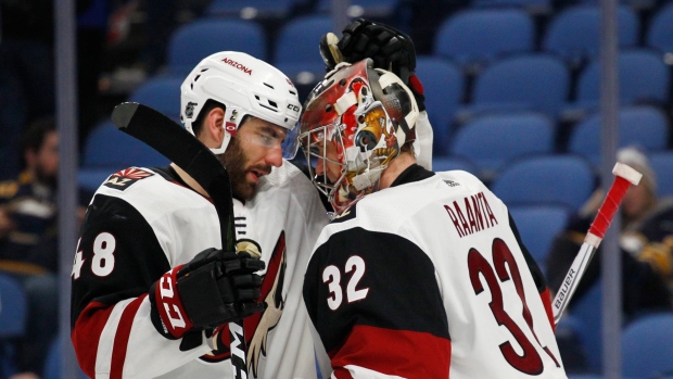 Jordan Martinook and goalie Antti Raanta