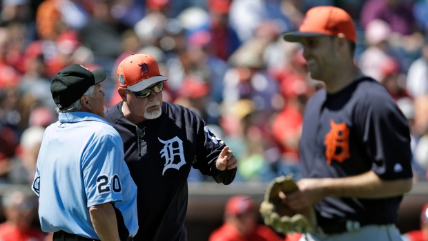 Detroit Tigers manager Ron Gardenhire, center, argues with home plate umpire Tom Hallion, The Canadian Press Detroit Tigers manager Ron Gardenhire, center, argues with home plate umpire Tom Hallion