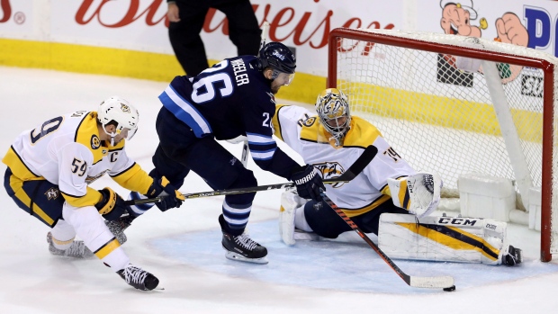 Roman Josi, Blake Wheeler, Juuse Saros , The Canadian Press Roman Josi, Blake Wheeler, Juuse Saros