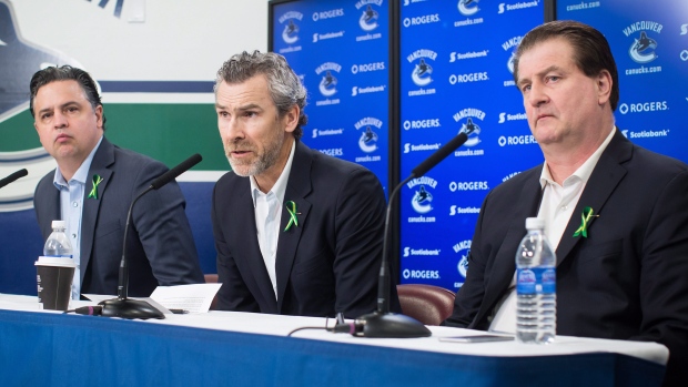 Travis Green Trevor Linden Jim Benning , The Canadian Press Travis Green Trevor Linden Jim Benning