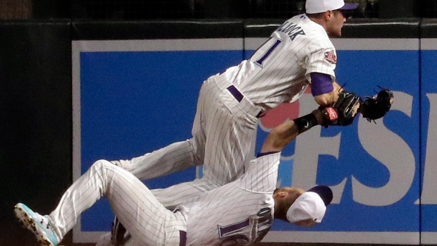 Chris Owings (16) collides with A.J. Pollock , The Canadian Press Chris Owings (16) collides with A.J. Pollock