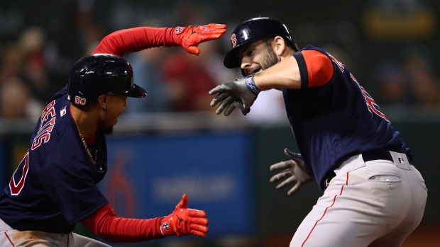 Mitch Moreland and Mookie Betts, The Canadian Press Mitch Moreland and Mookie Betts