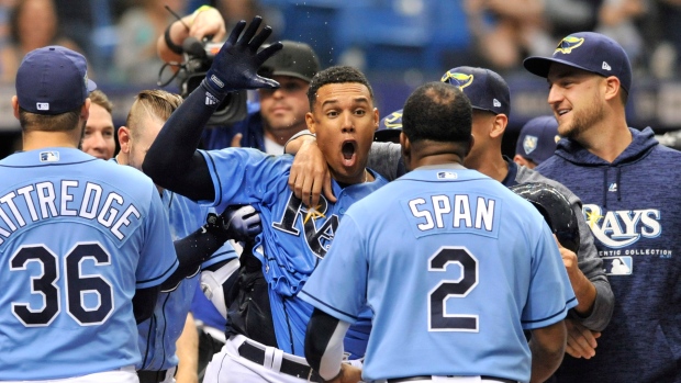 Carlos Gomez, Rays celebrate, The Canadian Press Carlos Gomez, Rays celebrate