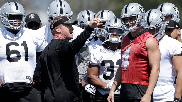 Jon Gruden, Derek Carr, The Canadian Press Jon Gruden, Derek Carr
