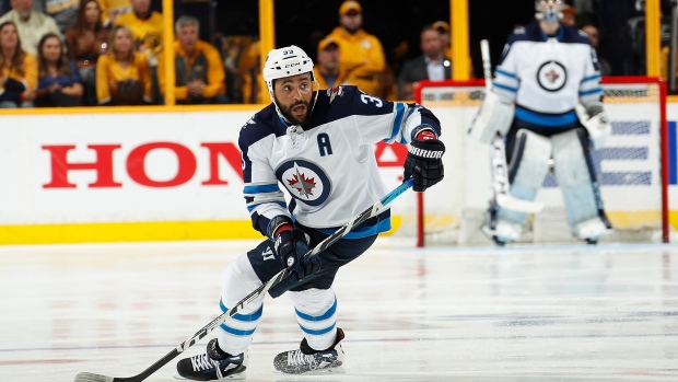 Dustin Byfuglien of the Winnipeg Jets salutes the fans after News Photo  - Getty Images