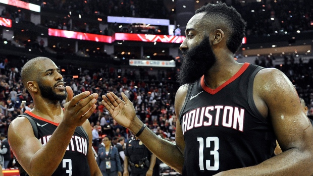 Chris Paul and James Harden celebrate