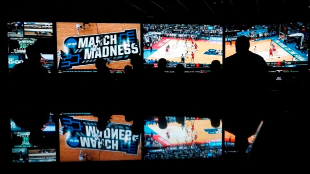 Bettors watching March Madness at a sportsbook, The Canadian Press Bettors watching March Madness at a sportsbook
