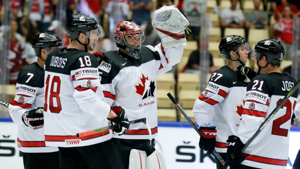 Darcy Kuemper, Team Canada celebrate, The Canadian Press Darcy Kuemper, Team Canada celebrate