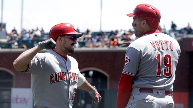 Adam Duvall and Joey Votto celebrate