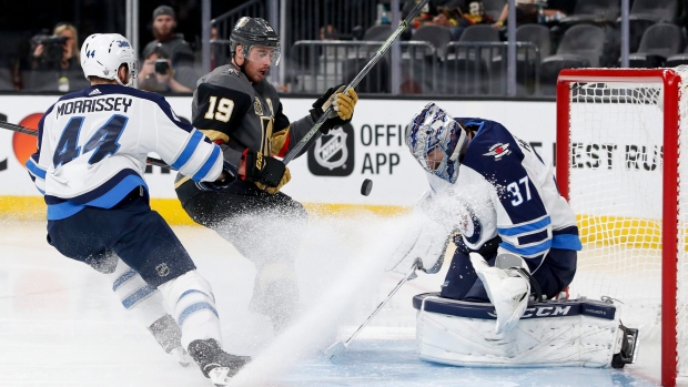 Connor Hellebuyck stops Reilly Smith, The Canadian Press Connor Hellebuyck stops Reilly Smith
