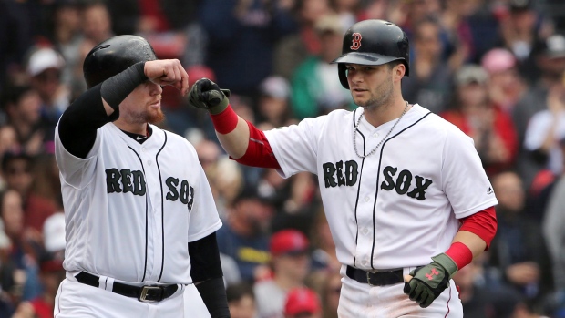 Andrew Benintendi and Christian Vazquez , The Canadian Press Andrew Benintendi and Christian Vazquez
