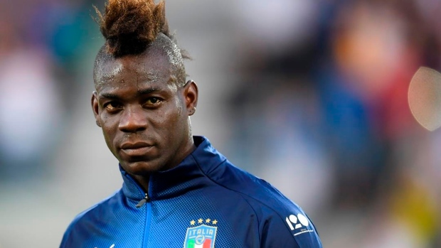 Balotelli praised for reacting to racist Italy fans' banner Article Image 0, The Canadian Press Balotelli praised for reacting to racist Italy fans' banner Article Image 0