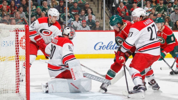 Noah Hanifin, Cam Ward and Justin Faulk