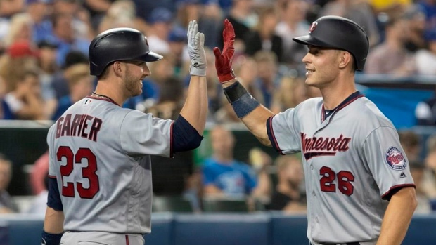 Mitch Garver and Max Kepler celebrate