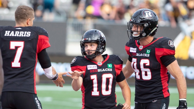 Redblacks kicker Lewis Ward and quarterback Trevor Harris 