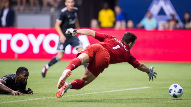 Stefan Marinovic and Doneil Henry , The Canadian Press Stefan Marinovic and Doneil Henry