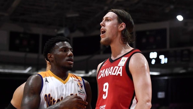 NBA players Dwight Powell and Kelly Olynyk during the Basketball