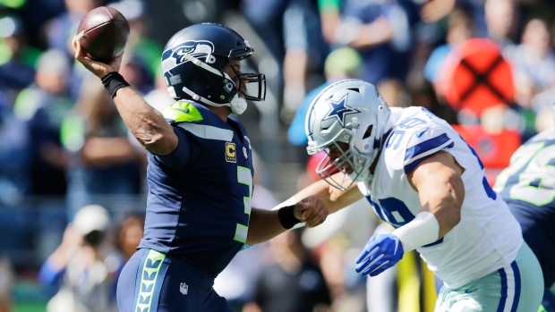 Russell Wilson, The Canadian Press Russell Wilson