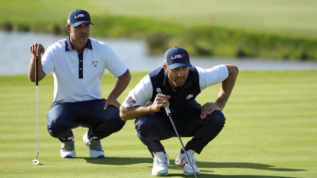 Brooks Kopeka and Dustin Johnson