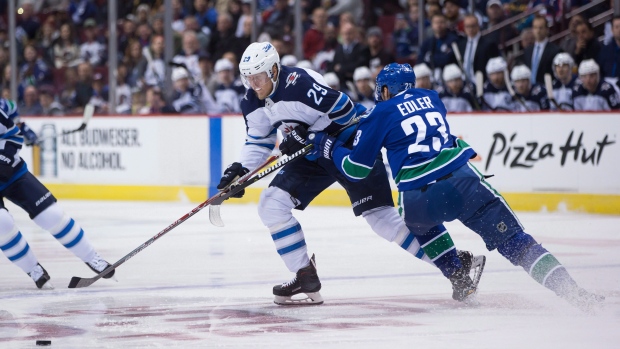 Patrik Laine and Alexander Edler, The Canadian Press Patrik Laine and Alexander Edler