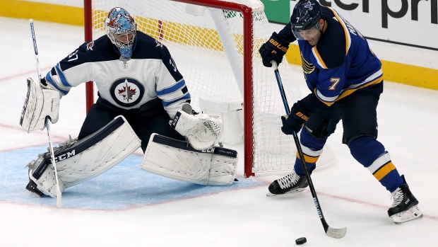 Connor Hellebuyck, Patrick Maroon, The Canadian Press Connor Hellebuyck, Patrick Maroon