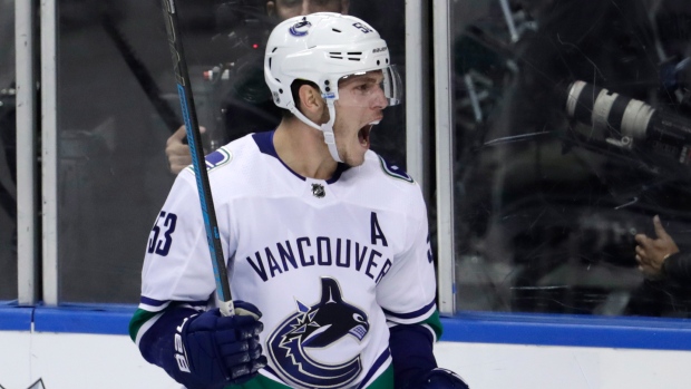 Four-vat Launches Canucks Past Bruins