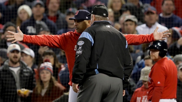 Alex Cora and Joe West , The Canadian Press Alex Cora and Joe West
